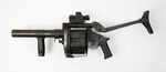 A 40 mm grenade launcher that stores multiple grenades like a revolver in a drum magazine